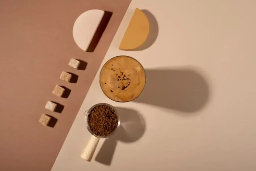 Top view delicious coffee cup and sugar cubes