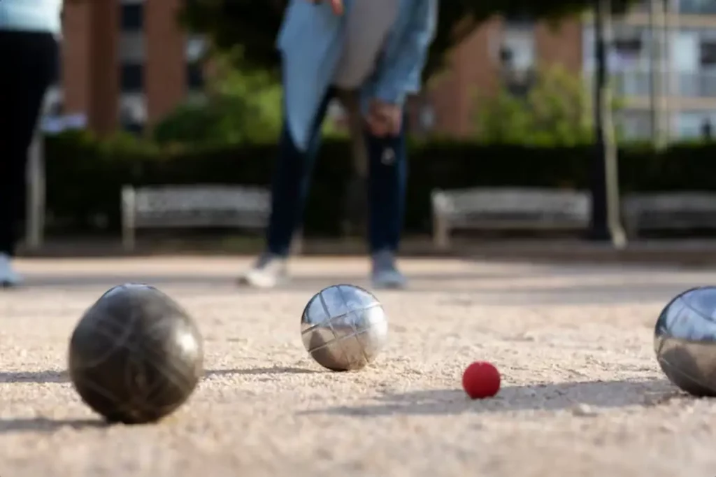 Elderly friends playing petanque